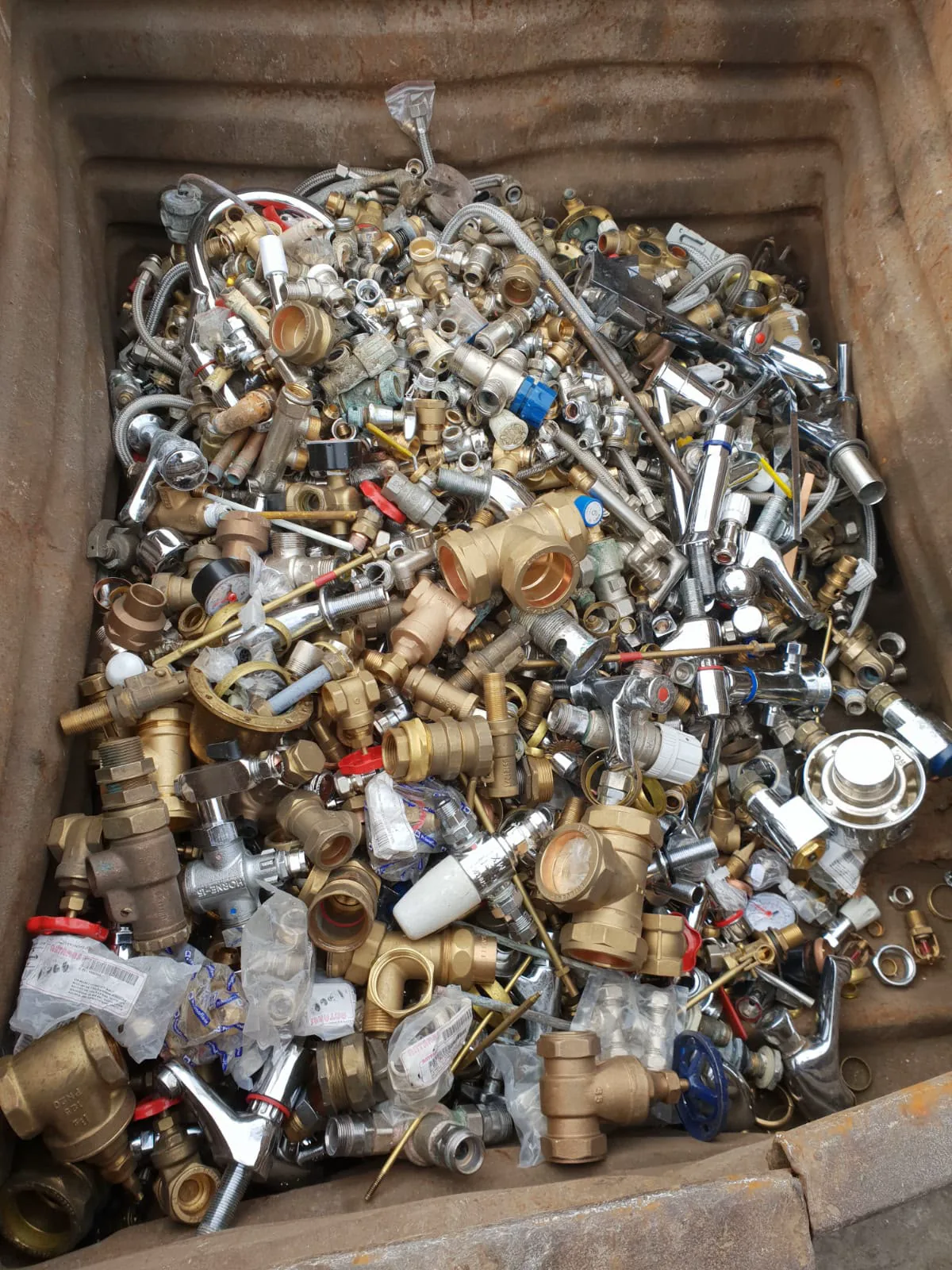 Mixed brass taps, valves and plumbing fittings